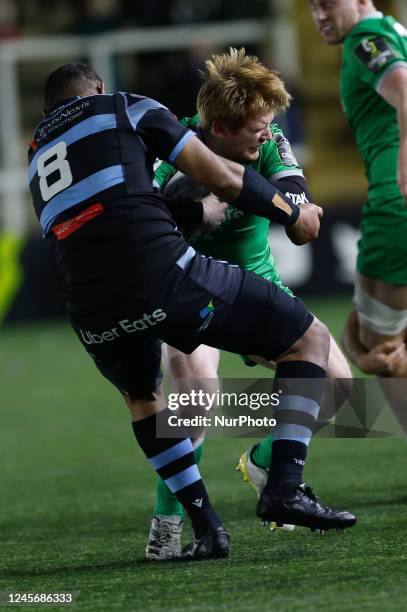 Zach Kerr of Newcastle Falcons is tackled by Taulupe Faletau of Cardiff Rugby during the European Rugby Challenge Cup match between Newcastle Falcons...