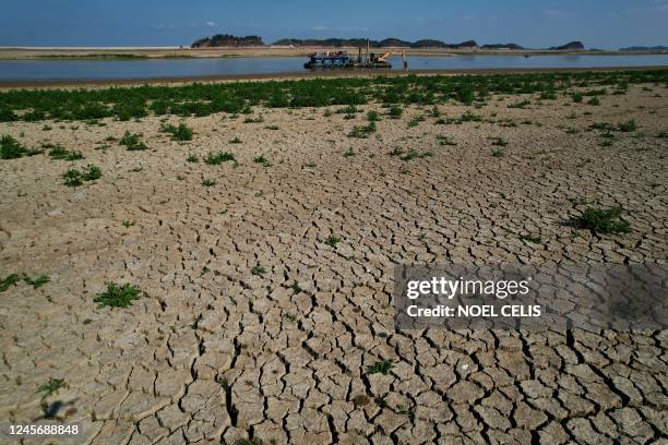 This aerial photo taken on November 7 shows the dried-up freshwater Poyang Lake in Juijiang, China's central Jiangxi province. - Spooked by a...