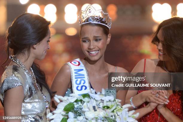 Newly elected Miss France Indira Ampiot celebrates with Miss France 2005 Cindy Fabre and Miss France 2022 Diane Leyre during the Miss France 2023...