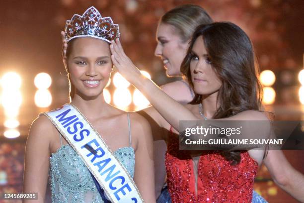 Newly elected Miss France Indira Ampiot is crowned by Miss France 2022 Diane Leyre during the Miss France 2023 beauty contest in Deols, central...