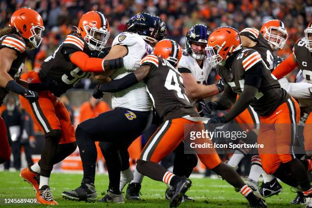 Cleveland Browns defensive end Jadeveon Clowney and Cleveland Browns safety John Johnson III stop Baltimore Ravens fullback Patrick Ricard on fourth...