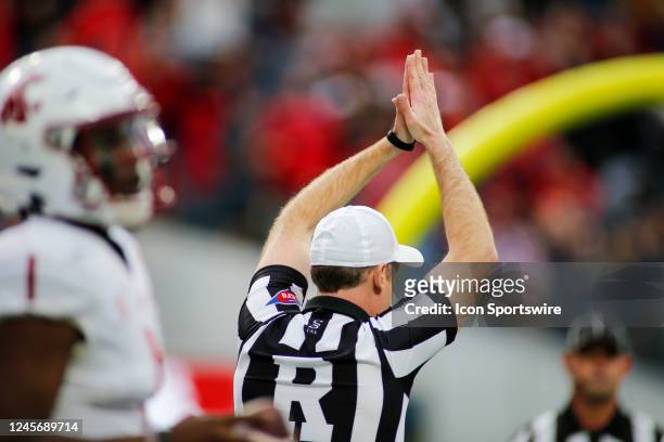 The referee signals a safety after Washington State Cougar QB Cameron Ward couldn't get out of his own endzone during the game between the Fresno...