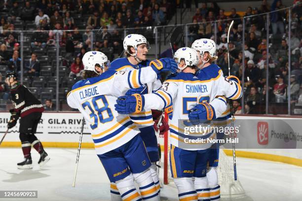 Jeff Skinner of the Buffalo Sabres celebrates with Kale Clague and teammates after scoring a goal against the Arizona Coyotes during the second...