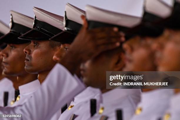 Sailor inspects the uniform of members of the ceremonial honor guards of the crew during the commissioning of INS Mormugao, the second stealth guided...