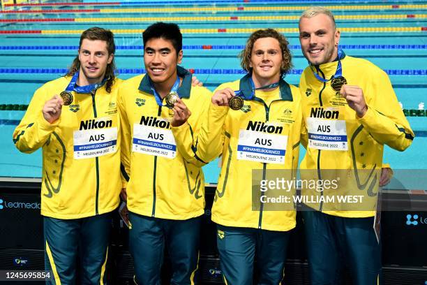 Australia's team poses with the gold medal after a tie with USA in the Men's 4x100, Medley Relay final at the FINA World Swimming Championships 2022...