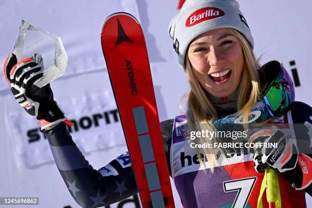 Mikaela Shiffrin celebrates with her tropny on the podium after winning the second Super-G of the FIS alpine skiing Women's World Cup event in Saint...