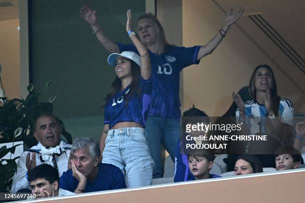 Argentina's forward Lionel Messi's wife Antonela Roccuzzo , mother Celia Maria Cuccittini and father Jorge Messi wait on the stands for the Qatar...