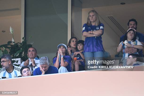 Argentina's forward Lionel Messi's wife Antonela Roccuzzo , son Ciro , mother Celia Maria Cuccittini and father Jorge Messi wait on the stands for...