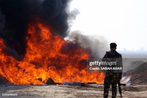 Iraqi government officials destroy nearly six tons of drugs, some of which had been in storage for more than a decade, in Baghdad's Nahrawan area on...