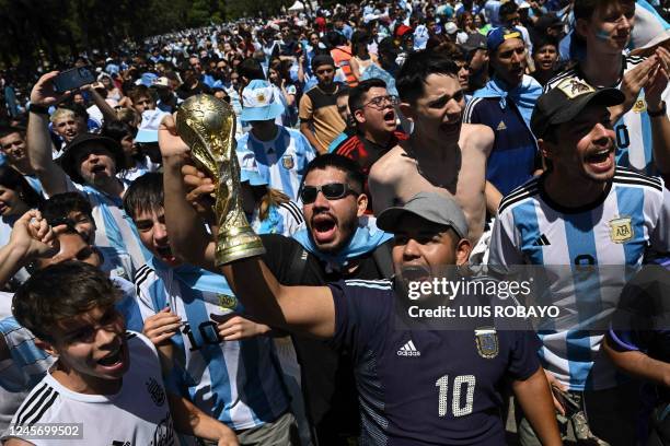 Fans of Argentina cheer before watching the live broadcast of the Qatar 2022 World Cup final football match between Argentina and France in Buenos...