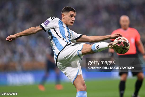 Argentina's defender Nahuel Molina kicks the ball during the Qatar 2022 World Cup final football match between Argentina and France at Lusail Stadium...