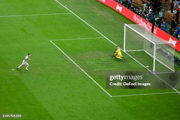 Lionel Messi of Argentina scores his team's first goal by penalty kick during the FIFA World Cup Qatar 2022 Final match between Argentina and France...