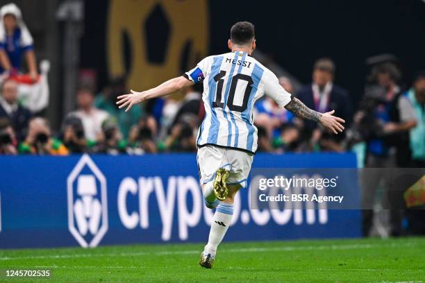 Lionel Messi of Argentina celebrates after scoring the team's first goal during the Final - FIFA World Cup Qatar 2022 match between Argentina and...