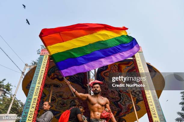 Participant is seen waving a pride flag during 17th Kolkata Rainbow pride walk in Kolkata , India , on 18 December 2022 .