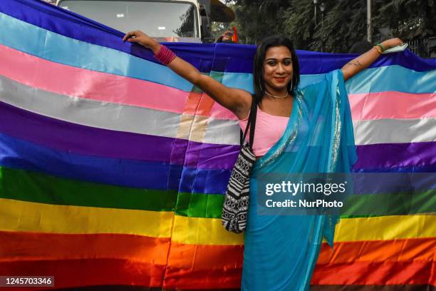 Participant is seen posing in front of a pride flag during 17th Kolkata pride walk in Kolkata , India , on 18 December 2022 .