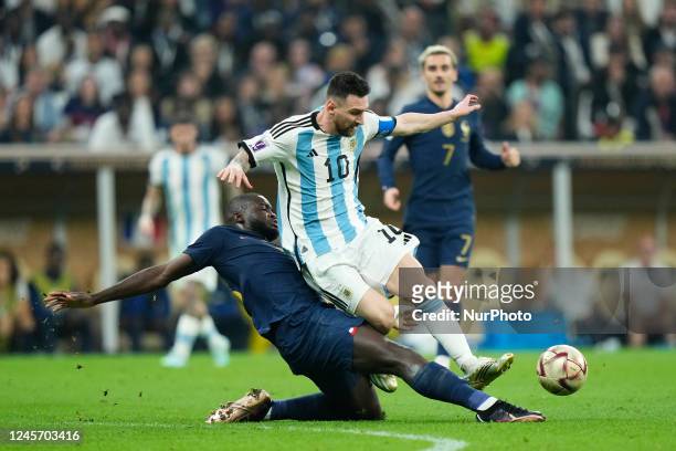 Lionel Messi right winger of Argentina and Paris Saint-Germain competes for the ball with Dayot Upamecano centre-back of France and Bayern Munich...