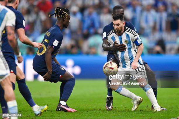 Lionel Messi of Argentina battles for the ball with Marcus Thuram of France during the Final - FIFA World Cup Qatar 2022 match between Argentina and...