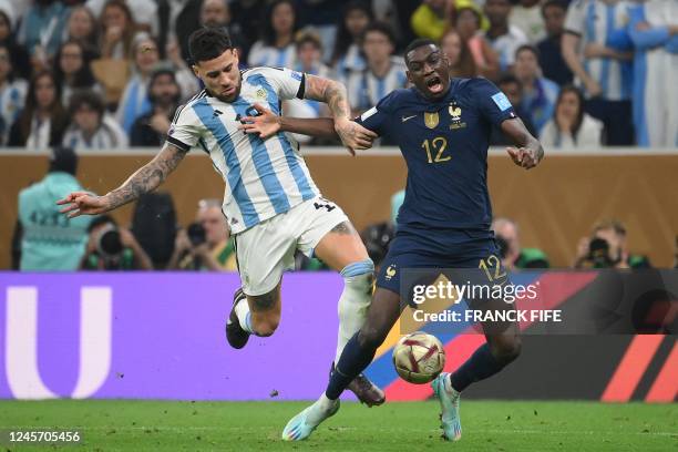 Argentina's defender Nicolas Otamendi fouls France's forward Randal Kolo Muani on the penalty box during the Qatar 2022 World Cup football final...