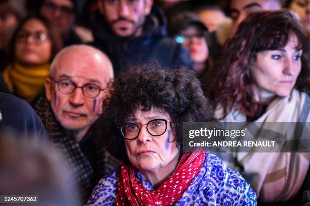 Fans react as they watch the Qatar 2022 World Cup Final football match between Argentina and France at Bar Tabac in Brooklyn, New York, on December...