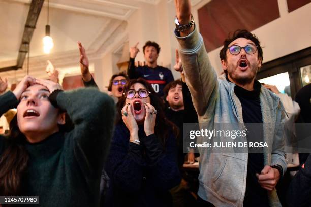 France's football fans react to a fault on a French player as they watch the final football match of the Qatar 2022 World Cup between Argentina and...