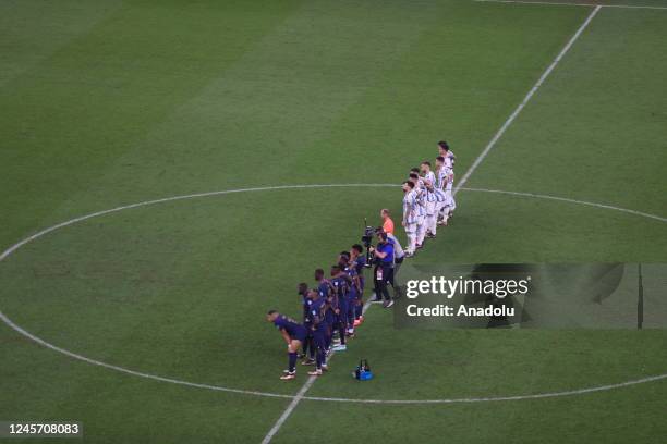 Players of Argentina and France wait in line during the penalty shoot-out stage of FIFA World Cup 2022 Final Match between Argentina and France at...