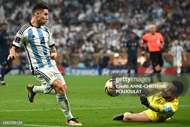 France's goalkeeper Hugo Lloris makes a save from a shot at goal by Argentina's defender Gonzalo Montiel during the Qatar 2022 World Cup final...