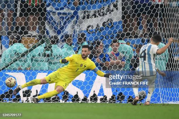 Argentina's defender Gonzalo Montiel scores past France's goalkeeper Hugo Lloris in the penalty shoot-out to win the Qatar 2022 World Cup football...