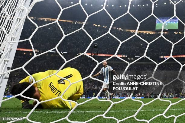 Argentina's defender Gonzalo Montiel scores a goal past France's goalkeeper Hugo Lloris during a penalty shoot-out in the Qatar 2022 World Cup final...