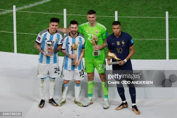 Argentina's midfielder Enzo Fernandez, Argentina's forward Lionel Messi, Argentina's goalkeeper Emiliano Martinez and France's forward Kylian Mbappe...