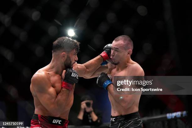 Arman Tsarukyan punches Damir Ismagulov in their Lightweight fight during the UFC Vegas 66 event at UFC Apex on December 17, 2022 in Las Vegas,...