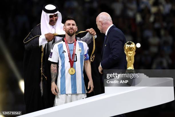 Emir of Qatar Sheikh Tamim bin Hamad Al Thani, Lionel Messi of Argentina and FIFA President Gianni Infantino with the world cup trophy, FIFA World...