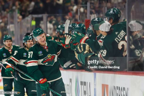 Kirill Kaprizov of the Minnesota Wild celebrates his goal against the Ottawa Senators with teammates in the first period of the game at Xcel Energy...
