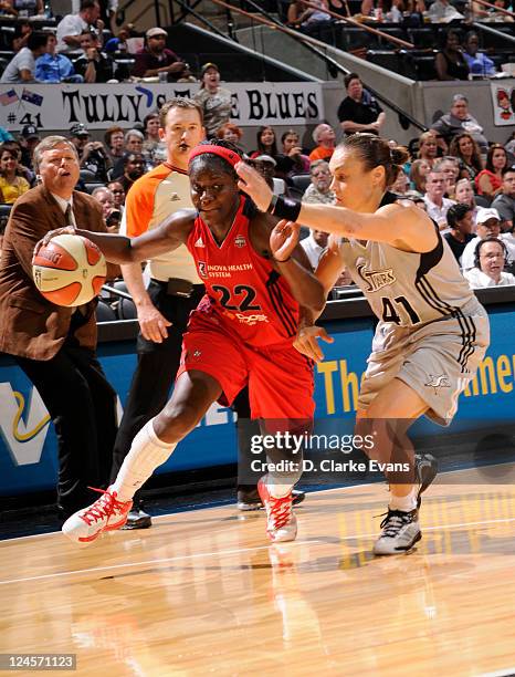 Matee Ajavon of the Washington Mystics drives against Tully Bevilaqua of the San Antonio Silver Stars at the AT&T Center on September 10, 2011 in San...