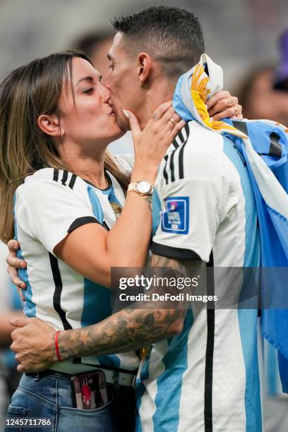 Angel Di Maria of Argentina kisses his wife Jorgelina Cardoso after the FIFA World Cup Qatar 2022 Final match between Argentina and France at Lusail...