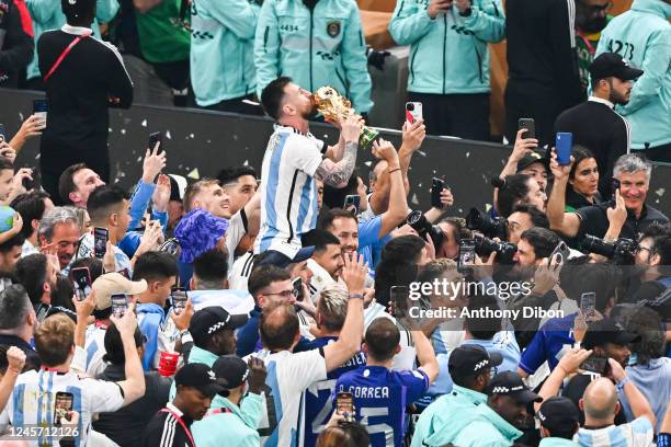 Lionel MESSI of Argentina kisses the world cup trophy during the FIFA World Cup 2022 Final between Argentina and France at Lusail Stadium on December...