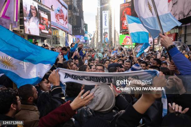 People celebrate after Argentina defeats France in the Qatar 2022 World Cup Final in Times Square in New York City on December 18, 2022.