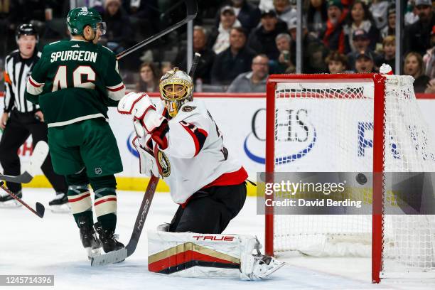 Jared Spurgeon of the Minnesota Wild scores a goal against Anton Forsberg of the Ottawa Senators in the second period of the game at Xcel Energy...