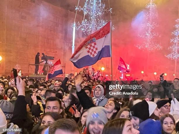 Croatian supporters celebrate during a welcoming ceremony upon the return of the Croatian national football team from the Qatar 2022 World Cup,...