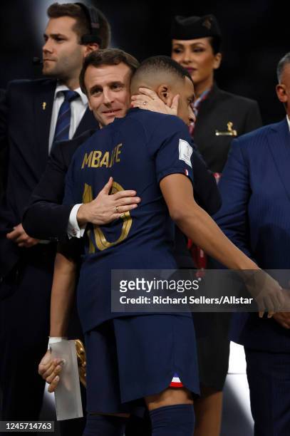 Kylian Mbappe of France is consoled by Emmanuel Macron President of France after defeat in the FIFA World Cup Qatar 2022 Final match between...