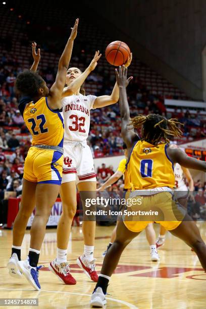 Indiana Hoosiers forward Alyssa Geary goes up with her shot over Morehead State Eagles guard Hallie Rhodes during a womens college basketball game...