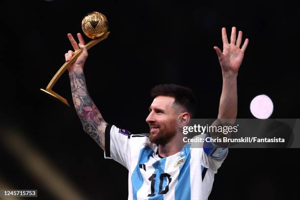 Lionel Messi of Argentina holds the adidas Golden Ball at the end of the FIFA World Cup Qatar 2022 Final match between Argentina and France at Lusail...