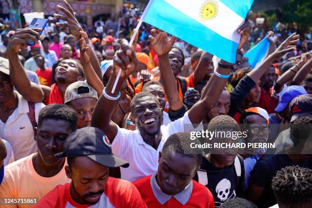 Haitians celebrate Argentina's victory over France in the Qatar 2022 World Cup Final football match in Port-au-Prince, Haiti, on December 18, 2022.