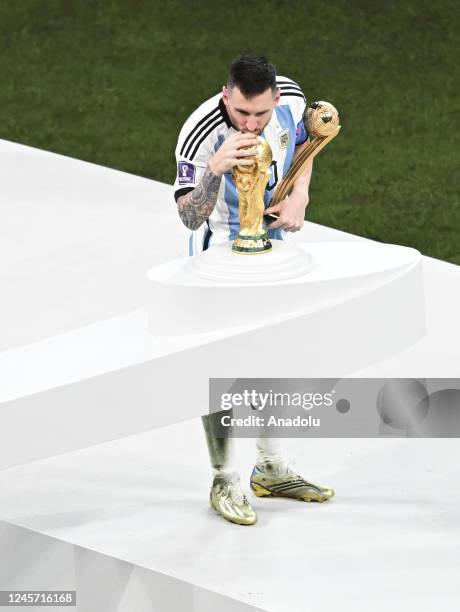 Lionel Messi of Argentina celebrate their victory with his award during a ceremony after FIFA World Cup 2022 Final Match between Argentina and France...