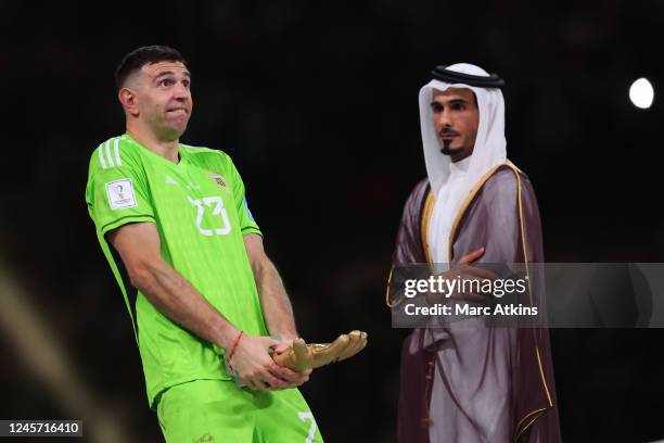 Emiliano Martinez of Argentina gestures with his Golden glove award during the FIFA World Cup Qatar 2022 Final match between Argentina and France at...