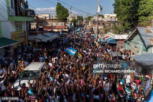 Haitians celebrate Argentina's victory over France in the Qatar 2022 World Cup Final football match in Port-au-Prince, Haiti, on December 18, 2022.