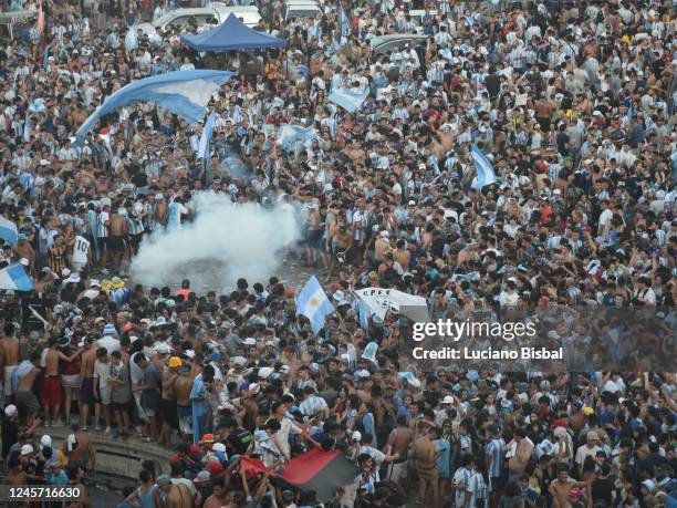 Fans of Argentina celebrate at the Flag Monument in Rosario after their team´s victory in the final match of the FIFA World Cup Qatar 2022 against...