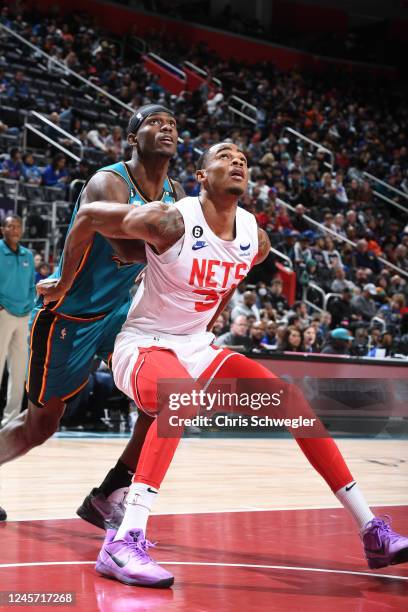 Nicolas Claxton of the Brooklyn Nets boxes out during the game against the Detroit Pistons on December 18, 2022 at Little Caesars Arena in Detroit,...