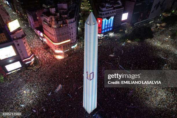 In this aerial view fans of Argentina celebrate winning the Qatar 2022 World Cup against France at the Obelisk in Buenos Aires, on December 18, 2022.