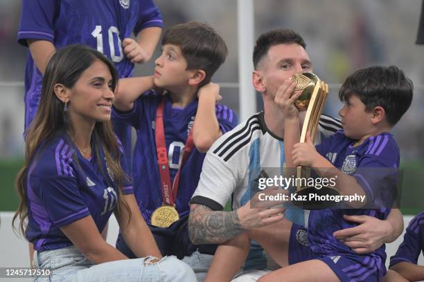 Lionel Messi of Artentina celebrates the win with MVP trophy with his family during the FIFA World Cup Qatar 2022 Final match between Argentina and...