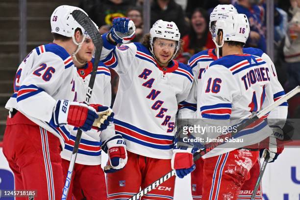 Artemi Panarin of the New York Rangers, center, celebrates with teammates after scoring a goal in the first period against the Chicago Blackhawks on...